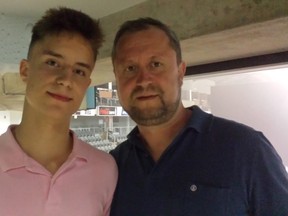Sixteen-year-old Russian-born Sergey Popov (left) and his dad, also named Sergey, in Kingston on Friday as part of orientation weekend for the Kingston Frontenacs. (Doug Graham/The Whig-Standard)