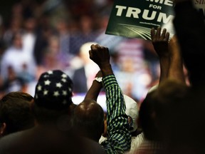 FRESNO, CA - MAY 27: Donald Trump supporters listen to the presumptive Republican presidential candidate speak at a rally in Fresno on May 27, 2016 in Fresno, California. Trump is on a Western campaign trip which saw stops in North Dakota and Montana yesterday and two more in California today.   Spencer Platt/Getty Images/AFP