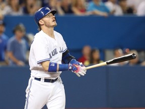 Toronto Blue Jays hitter Josh Donaldson watches his home run leave the ballpark during a game against the Boston Red Sox in Toronto on Friday, May 27, 2016. (THE CANADIAN PRESS/Fred Thornhill)