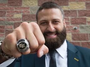 Mike Reilly shows off his Grey Cup ring, in Edmonton Alta. on Friday May 27, 2016. Members of the Edmonton Eskimos received their Grey Cup rings during a private ceremony at the Chateau Nova Yellowhead Hotel, 13920 Yellowhead Trail.