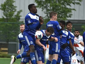 EDMONTON, ALTA: MAY 22, 2016 -- FC Edmonton defend against a free kick after a foul in the las seconds of the match sealing the 1 - 0 win against the Carolina RailHawks during NASL at Clarke Field in Edmonton, May 22, 2016.