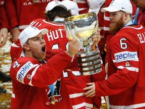 Ice Hockey - 2016 IIHF World Championship - Gold medal match - Finland v Canada - Moscow, Russia - 22/5/16 - Taylor Hall and Ryan Ellis of Canada celebrate with the trophy during the victory ceremony after the final game.