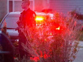 Edmonton police work at the scene of a fatal shooting near 286 Ozerna Road, in Edmonton Alta. on Friday May 27, 2016.