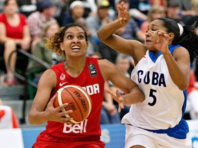 Canada's Miah-Marie Langlois, left, drives past Cuba's Ineidis Casanova Gonzalez during second half action of the 2015 FIBA Americas Women's Championship Final in Edmonton, Alta., on Sunday, August 16, 2015.