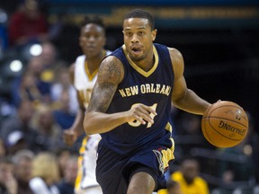 In this Oct. 3, 2015, file photo, New Orleans Pelicans' Bryce Dejean-Jones (31) races the ball up court during the first half of a preseason NBA basketball game against the Indiana Pacers in Indianapolis. Police say Saturday, May 28, 2016,  Dejean-Jones was fatally shot after breaking down the door to a Dallas apartment. Sr. Cpl. DeMarquis Black said in a statement that officers were called early Saturday morning and found the 23-year-old player collapsed in an outdoor passageway. He was taken to a hospital where he died.  (AP Photo/Doug McSchooler, File)