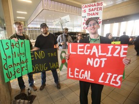 Steven Stairs (right) is a marijuana advocate, he was demonstrating close to where Prime Minister Justin Trudeau was speaking, in Winnipeg.   Friday, May 27, 2016. (Winnipeg Sun/Postmedia Network)