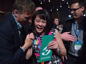 Conservative MP Maxime Bernier, left, hugs delegate Natalie Pon as she celebrates the yes vote to change the wording of the traditional definition of marriage in the conservative policies at the Conservative Party of Canada convention in Vancouver on Saturday, May 28, 2016. THE CANADIAN PRESS/Jonathan Hayward
