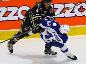 Kasperi Kapanen of the Toronto Marlies gets hit by Madison Bowey of the Hershey Bears during game 3 of the Eastern Conference Finals of the AHL playoffs at the Ricoh Coliseum in Toronto on Wednesday May 25, 2016. (Dave Abel/Toronto Sun)