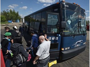 Passengers disembark May 29, 2016, on the first bus to stop at the new Greyhound station which opened in the Via Rail location.