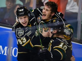 London Knights' Matthew Tkachuk, centre, celebrate the game-winning goal in the team's overtime victory in CHL Memorial Cup championship game hockey action against the Rouyn-Noranda Huskies in Red Deer, Sunday, May 29, 2016.THE CANADIAN PRESS/Jeff McIntosh