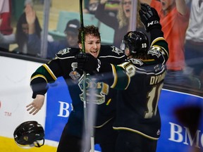 London Knights forwards Matthew Tkachuk and Christian Dvorak celebrate the Memorial Cup-winning goal against the Rouyn-Noranda Huskies in Red Deer, Alta., on May 29, 2016. (THE CANADIAN PRESS/Jeff McIntosh)