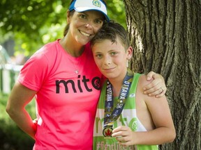 Julie Drury and her son Jack Drury after finishing the 5K race part of Tamarack Ottawa Race Weekend on Saturday. On Sunday, Julie Drury ran the full marathon to raise funds and awareness for mitochondrial disease, a disease her daughter, Kate, died from six months ago.