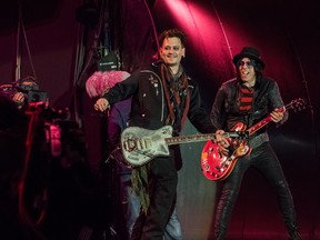 Johnny Depp, centre, and Tommy Henriksen of the Hollywood Vampires perform in Lisbon, May 27, 2016. (Rui M Leal/WENN.COM)