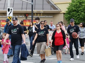 Walkers participate in the Attawapiskat First Nation Walk for Awareness in Sudbury, Ont. on Saturday May 28, 2016. Students and staff from Rainbow District School Board and the Wabnode Centre for Aboriginal Services at Cambrian College hosted the event. The theme of the walk was Youth for Youth (Y4Y). Young people from Attawapiskat walked in the event as honoured guests. John Lappa/Sudbury Star/Postmedia Network
