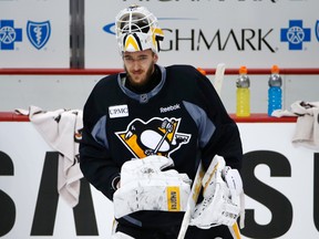 Pittsburgh Penguins goalie Matt Murray takes a break during a hockey practice at the Consol Energy Center in Pittsburgh.