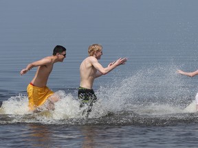 Quinn Chow, Neil Thorslund and Shannon Smith cool down at Britannia Beach. Tony Caldwell/Postmedia