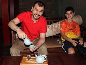 Canadian Salim Alaradi and his son, Mohamed Alaradi are shown on a family vacation in the United Arab Emirates in a 2013 family handout photo. THE CANADIAN PRESS/HO, File