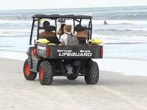 A Neptune Beach lifeguard vehicle is seen in this AP video screen grab.