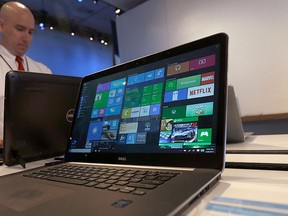 In this April 29, 2015, file photo, a Dell laptop computer running Windows 10 is on display at the Microsoft Build conference in San Francisco. (AP Photo/Jeff Chiu, File)