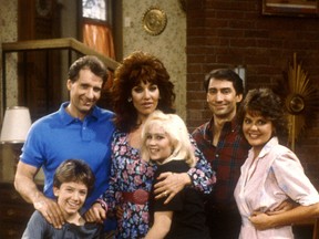 Married with Children cast (standing) Ed O'Neill (as Al Bundy). Katey Sagal (as Peg Bundy), David Garrison (as Steve Rhoades), Amanda Bearse (as Marcy Rhoades). (seated) David Faustino (as Bud Bundy), Christina Applegate (as Kelly Bundy).