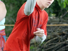 Ryan Dewhirst of Petrolia, takes part in axe throwing at the 10th annual Metis Rendezvous held Sunday in Wallaceburg. An organizer of the event, Marie Laprise, has been helping numerous Metis obtain their new status card since a Supreme Court of Canada ruling in April.
David Gough/Postmedia Network