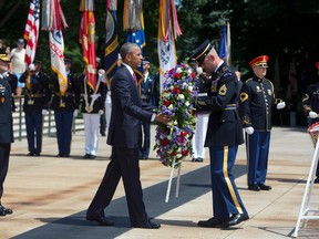 President Barack Obama lays a wreath at the Tomb of the Unknowns, on Memorial Day, Monday, May 30, 2016, at Arlington National Cemetery in Arlington, Va. (AP Photo/Pablo Martinez Monsivais)