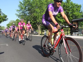 Almost 30 riders travel through Kingston on Monday in their round-the-lake cycle tour to raise money for pancreatic cancer research. (Michael Lea/The Whig-Standard)