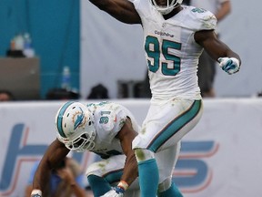 Defensive end Cameron Wake and defensive end Dion Jordan of the Miami Dolphins . (Rob Foldy/Getty Images/AFP)