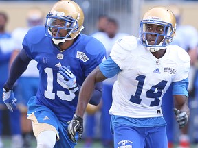 Winnipeg Blue Bombers wide receiver Quincy McDuffie (r) runs a pattern with defensive back Jonte Green during CFL football practice in Winnipeg, Man. Monday May 30, 2016.
BRIAN DONOGH/Winnipeg Sun