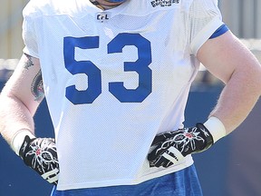 Winnipeg Blue Bombers offensive lineman Patrick Neufeld watches play Winnipeg Blue Bombers wide receiver during CFL football practice in Winnipeg, Man. Monday May 30, 2016.