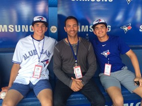Former Blue Jays player Jose Cruz Jr., flanked by his sons Trei and Antonio, were born in Toronto and both can play for Canada at the World Baseball Classic. (Jose Cruz Jr. photo)