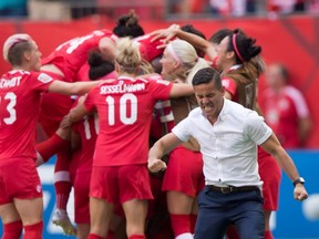 Canada coach John Herdman pumps his fist as his team celebrates a goal against Switzerland during the 2015 FIFA Women’s World Cup. As part of its preparation for the Summer Olympics, Canada is playing Brazil in a friendly on Saturday at BMO Field. (The Canadian Press/Files)