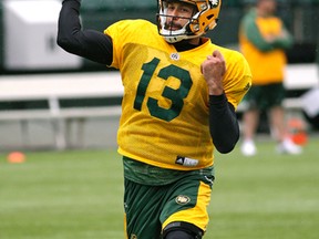 Mike Reilly practised against a Mike Benevides defence when they were both part of the championship B.C. Lions in 2011. (Larry Wong)