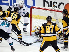 Sharks forward Patrick Marleau (12) scores past Penguins goalie Matt Murray (30) during second period action in Game 1 of the Stanley Cup final in Pittsburgh on Monday, May 30, 2016. (Gene J. Puskar/AP Photo)