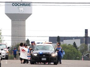Members of Intégration Communautaire Cochrane Community Living and the Cochrane Ontario Provincial Police participated in the Torch Run for Special Olympics last week.
