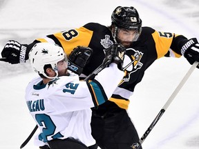 Patrick Marleau of the San Jose Sharks collides with Kris Letang of the Pittsburgh Penguins during Game 1 of the 2016 Stanley Cup final at Consol Energy Center on May 30, 2016 in Pittsburgh. (Jamie Sabau/Getty Images/AFP)