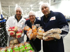 The Ozery family who are big in the pita and speciality bread business L-R Alon Ozery, father Al Ozery and Guy Ozery with some of their product which they ship across North America from their Vaughan plant on Wednesday May 18, 2016. Michael Peake/Toronto Sun/Postmedia Network