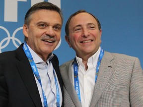 IIHF president Rene Fasel and NHL Commissioner Gary Bettman pose for a photo during a press conference at the 2014 Olympics in Sochi, Russia, on Feb. 18, 2014. (Al Charest/Calgary Sun)