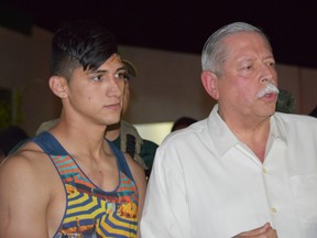 Mexican soccer player Alan Pulido, left, stands next to Tamaulipas State Gov. Egidio Torre Cantu after Pulido was rescued from kidnappers early Monday, May 30, 2016 in Ciudad Victoria, Mexico. (AP Photo/Alfredo Pena)