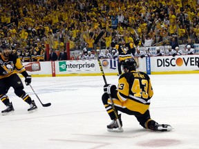 Pittsburgh Penguins' Conor Sheary celebrates his goal with Kris Letang during the first period in Game 1 of the Stanley Cup final against the San Jose Sharks in Pittsburgh on May 30, 2016. (AP Photo/Keith Srakocic)