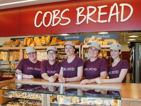 Ashley Logan, centre, owner of Cobs Bread, poses for a photo with her staff in the recently opened bakery in Kingston. Logan donated the opening day sales, a total of $3,750, to the Whig-Standard/Boys and Girls Club campaign. (Julia McKay/The Whig-Standard)