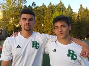 Eric Rebelo, left, and Nino D'Amore of the Holy Cross Crusaders senior boys soccer team. Both of them scored in the Crusaders' 2-1 extra-time victory over the Kingston Blues in the Kingston Area championship game.
(Doug Graham/The Whig-Standard)