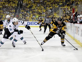 Sidney Crosby of the Pittsburgh Penguins skates against Justin Braun of the San Jose Sharks during the first period in Game 1 of the Stanley Cup final at Consol Energy Center in Pittsburgh on May 30, 2016. (Bruce Bennett/Getty Images/AFP)