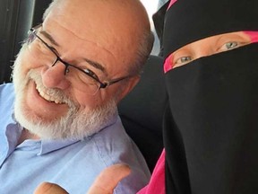Bus driver Alain Charette with Hailey DeJong, who was harassed while wearing a niqab on an OC Transpo bus. Charette chased off the jerk.