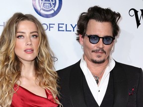 In this Jan. 9, 2016 file photo, Amber Heard, left, and Johnny Depp arrive at The Art of Elysium's Ninth annual Heaven Gala at 3LABS, in Culver City, Calif. (Rich Fury/Invision/AP, File)