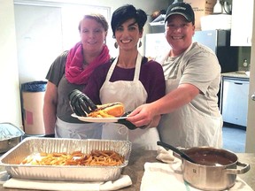 Steelway Building Systems of Aylmer made a sizable financial contribution to help residents of Fort McMurray who have lost everything because of recent wildfires. Pictured at a fundraising barbecue are Bonnie Taylor, left, Rita Perepelitsky and Sheri Weesjes.
