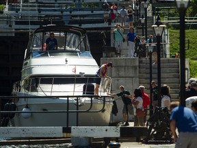 Boats wait to enter Rideau river during a sunny afternoon at Ottawa locks at Rideau Canal. James Park/Postmedia
