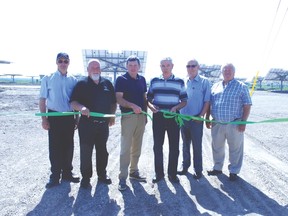 At the ribbon cutting for the Agris Coop Sola rfarm  last week in Dutton were left, Dutton/Dunwich Counc. Mike Hentz, Deputy Mayor Bob Purcell, Dutton/Duniwch Mayor Cameron McWilliam, Dave Mallottt of the Agris Solar Co-Op and Dutton/Dunwich Councillors Ian Fleck and Dan McKillop.
