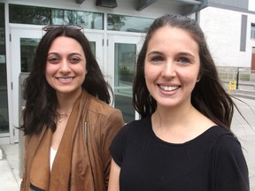 Katrina D'Urzo, left, and Andrea Brennan, both students in the school of kinesiology and health studies at Queen's University are helping organize Move With Our Docs, a two-kilometre walk by doctors and their patients to promote physical fitness. (Michael Lea/The Whig-Standard)
