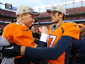 Denver Broncos quarterback Peyton Manning, left, is congratulated by quarterback Brock Osweiler following their  20-18 win over the New England Patriots in the AFC championship NFL football game in Denver. (AP Photo/Joe Mahoney, File)